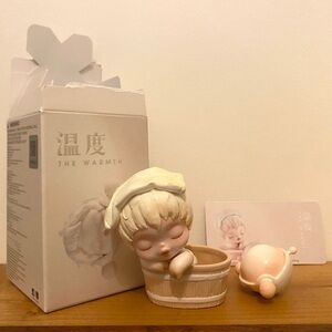 Pop Mart Skullpanda Warmth Series Figure “Loosening”